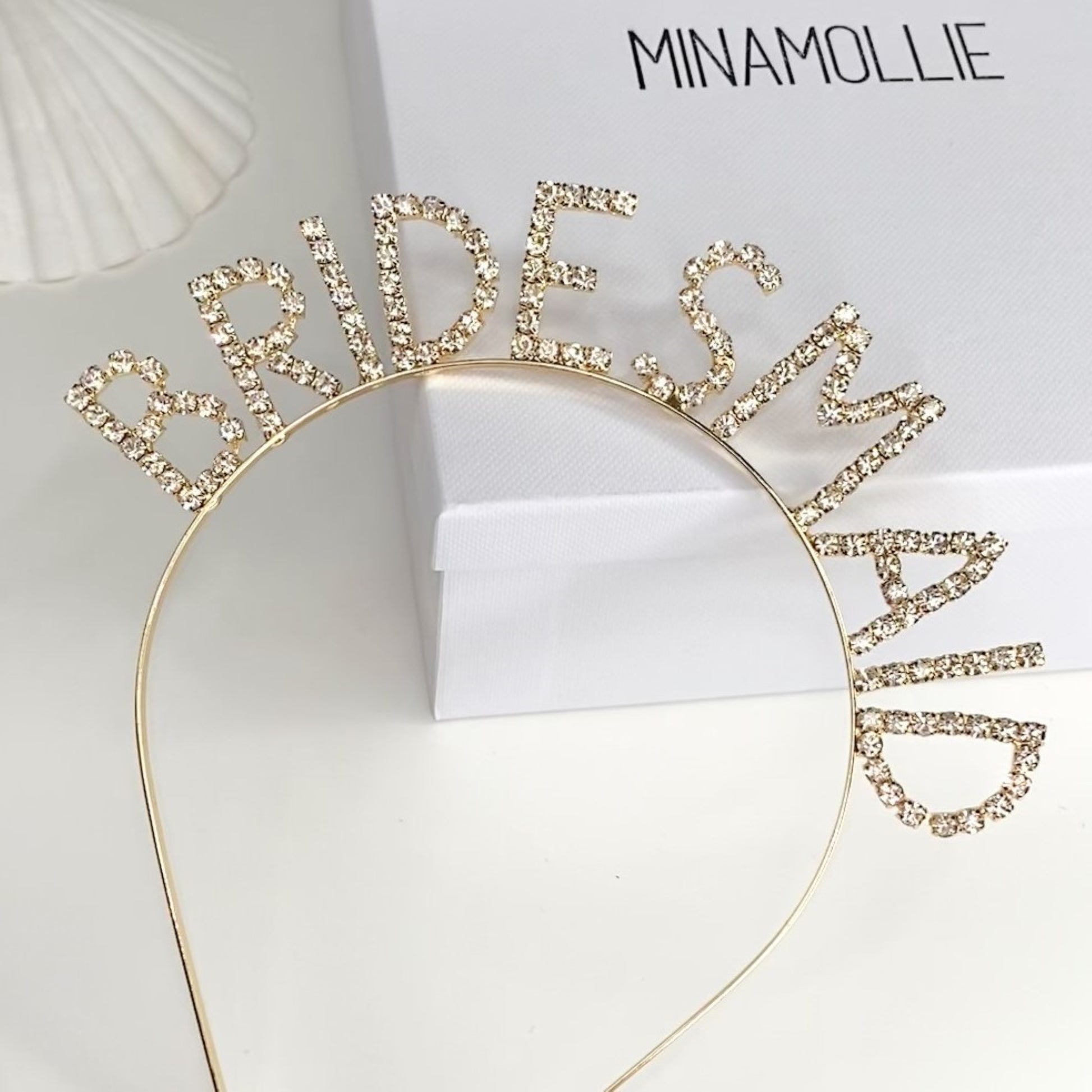 The perfect gift for your bridesmaid, bridesmaid slogan diamante headband in gold. 